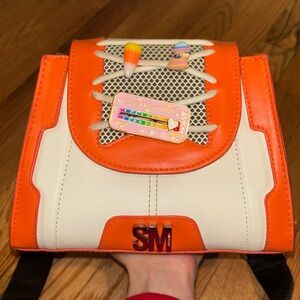 This is a Steve Madden sneaker crossbody bag! Used/doesn’t have dust bag or tags